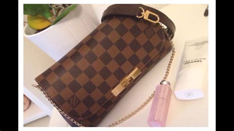 lv eva clutch vs favorite pm